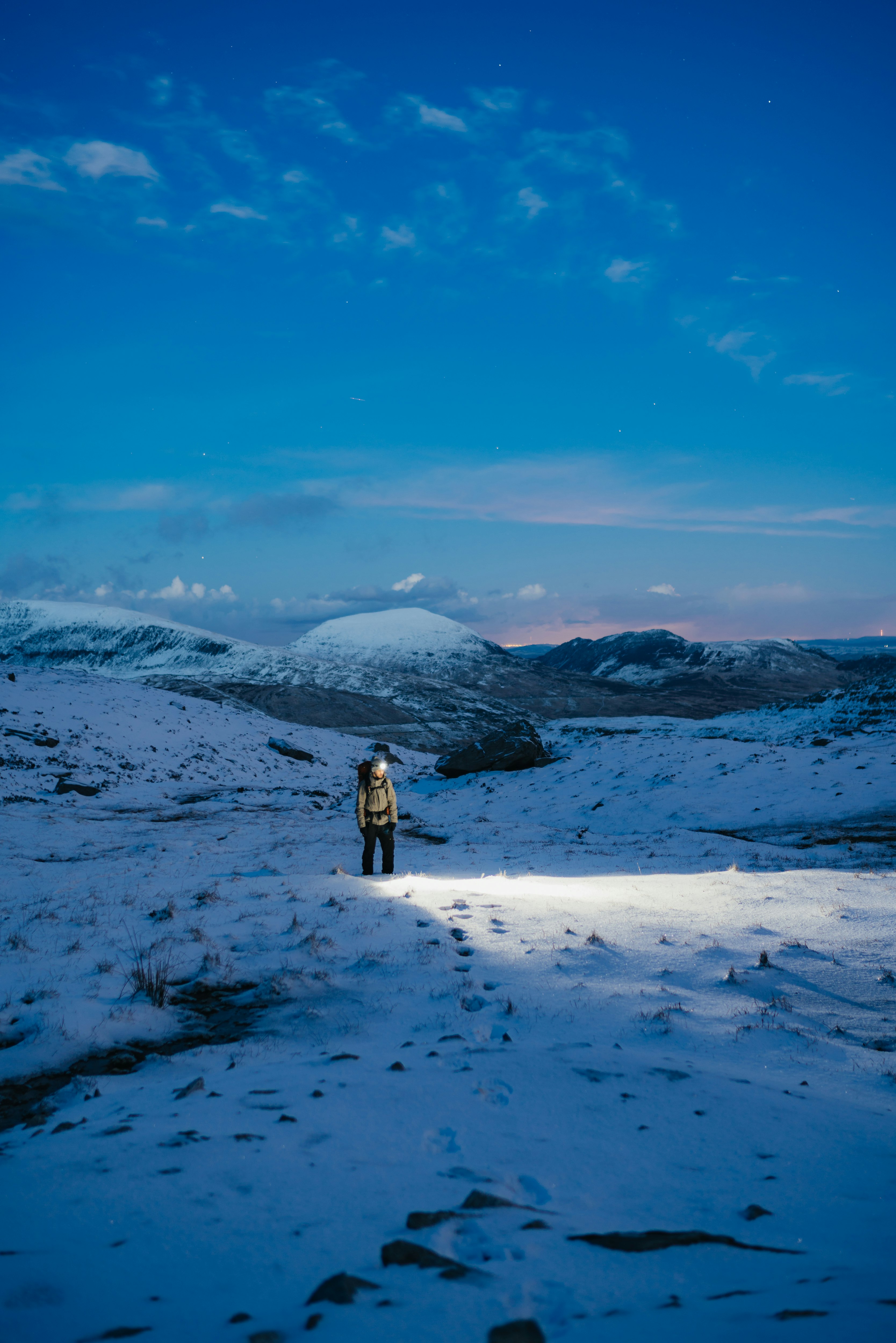 person standing surrounding snow